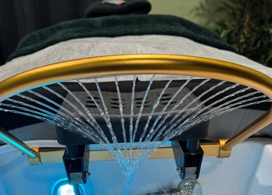 Luxurious spa treatment setup at The Zen Den Ltd., Roseau, Saint George Parish, DM, with cascading water jets.