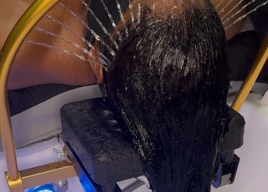 Refreshing water treatment at The Zen Den Ltd., Roseau, Saint George Parish, DM, enhancing hair wellness.