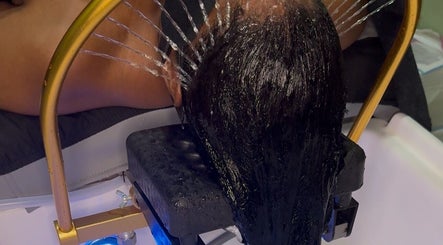 Refreshing water treatment at The Zen Den Ltd., Roseau, Saint George Parish, DM, enhancing hair wellness.