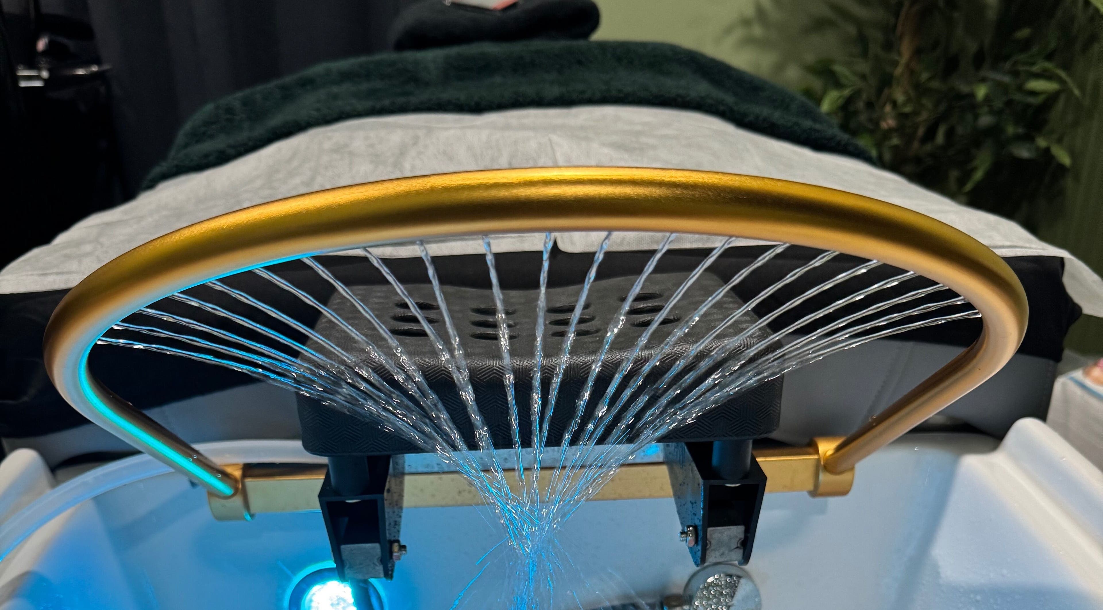 Luxurious spa treatment setup at The Zen Den Ltd. in Roseau, Saint George Parish, DM with golden accents.