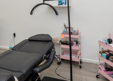 Treatment room at Eye Candy Lash and Brow Bar in Sarasota, Florida, US, featuring a modern lash station.