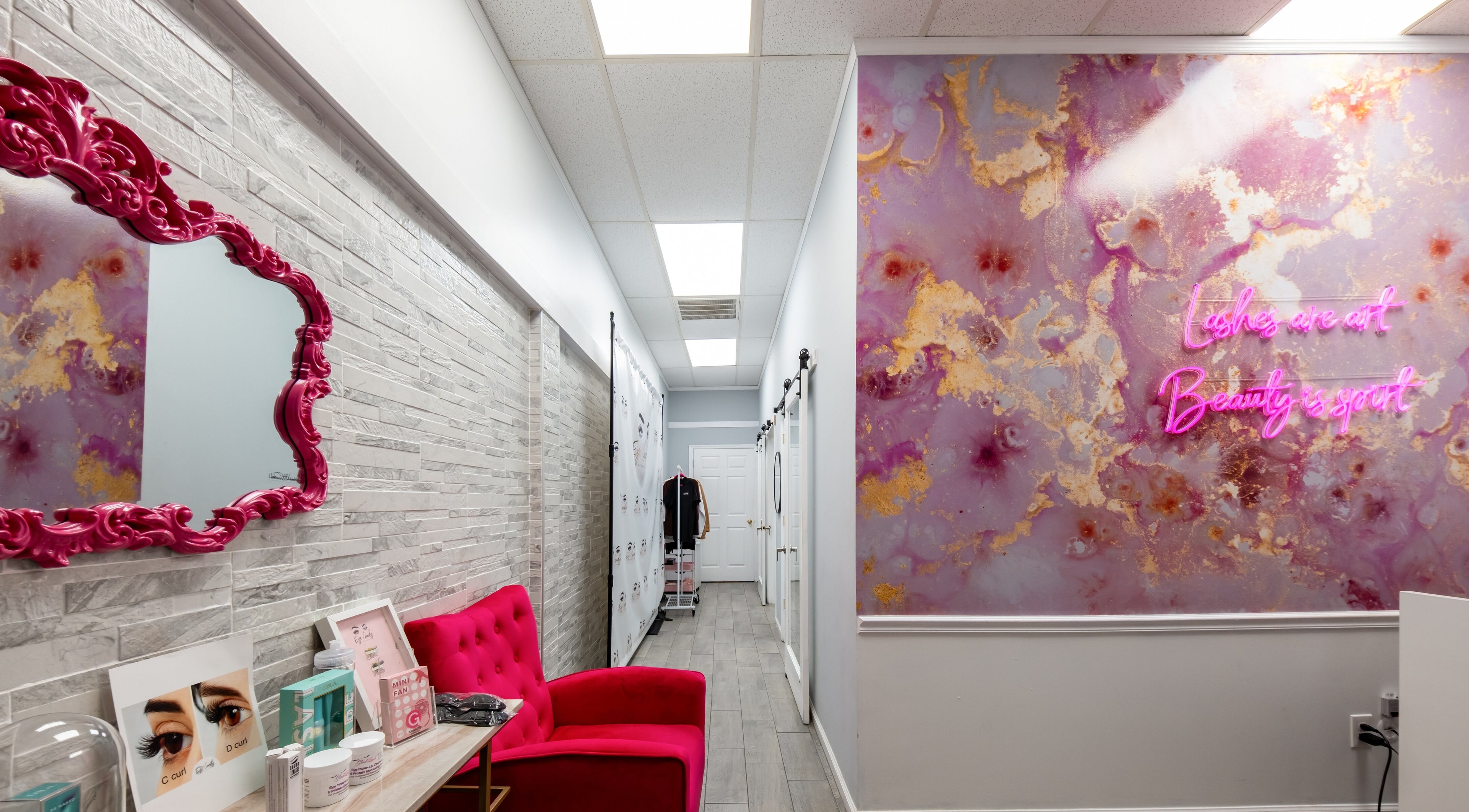 Eye Candy Lash and Brow Bar's chic interior with vibrant decor in Sarasota, Florida, US.