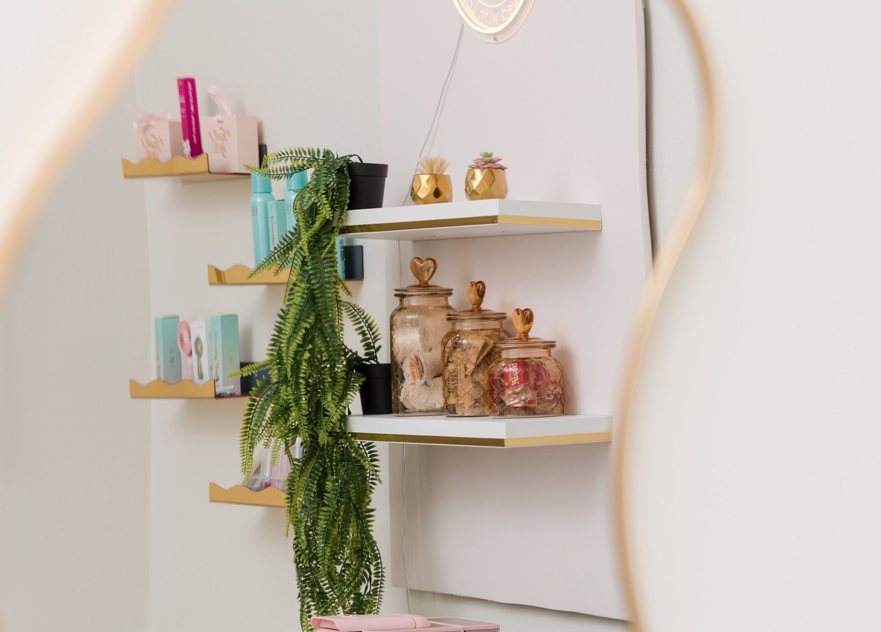Elegant display shelves at Eye Candy Lash and Brow Bar in Sarasota, Florida, US featuring stylish decor.