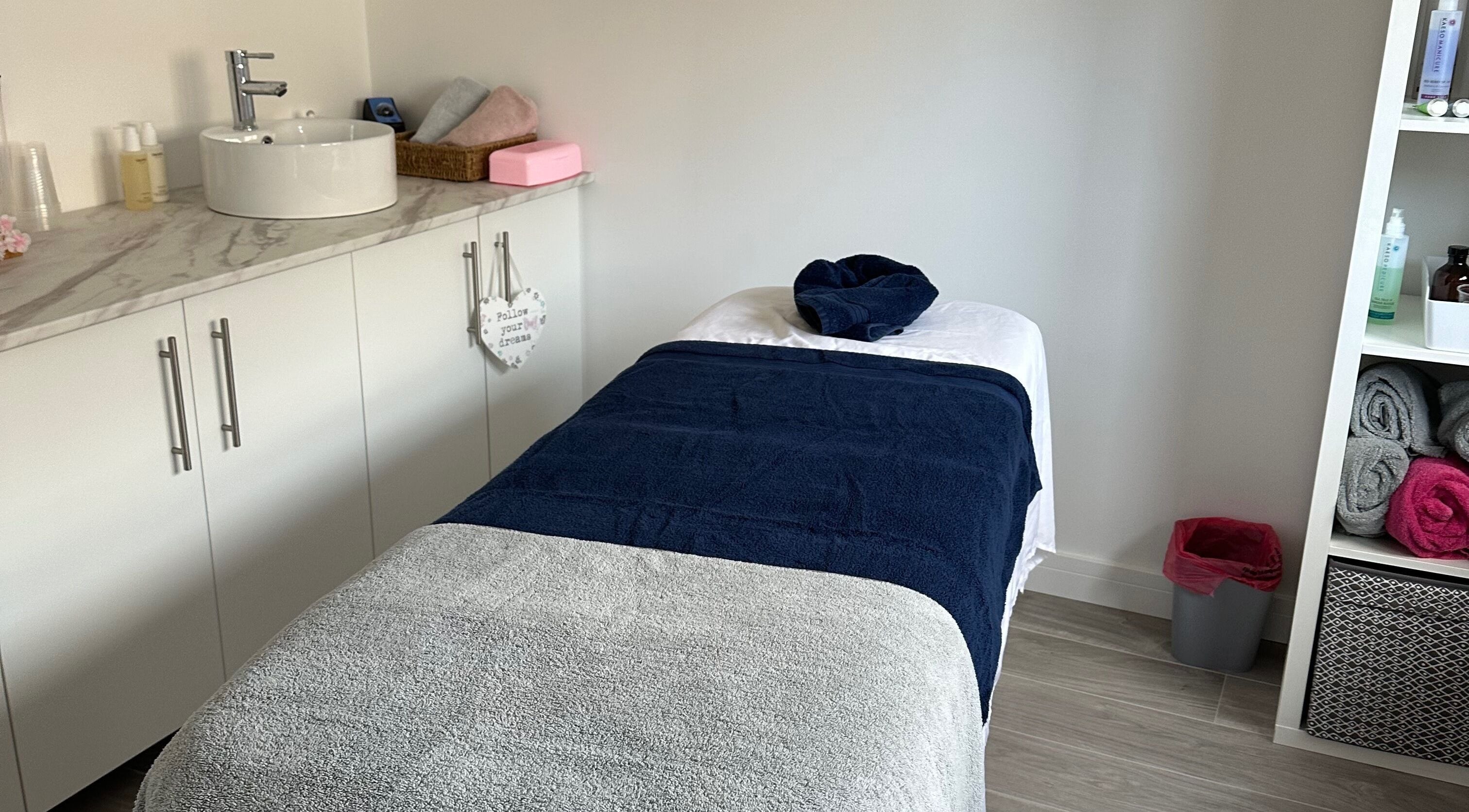Relaxing treatment room at V Beauty by Victoria in Rochford, England, GB featuring calming decor.