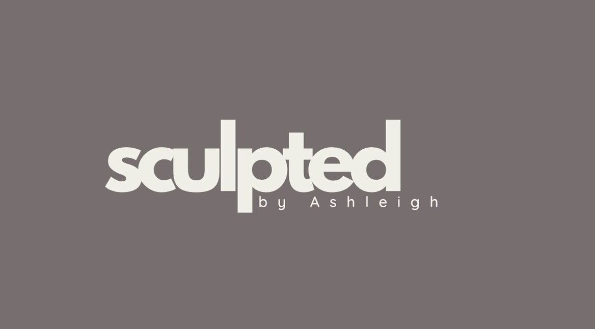 Sculpted by Ashleigh logo on a grey background, representing the beauty venue in Moreton, England, GB.