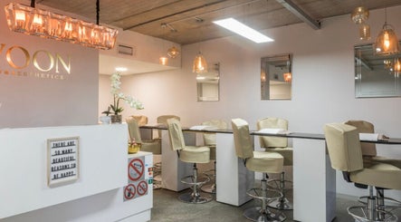 Chic interior of Swoon Beauty & Aesthetics, Ballito, Kwazulu-natal, ZA, featuring elegant seating and ambient lighting.
