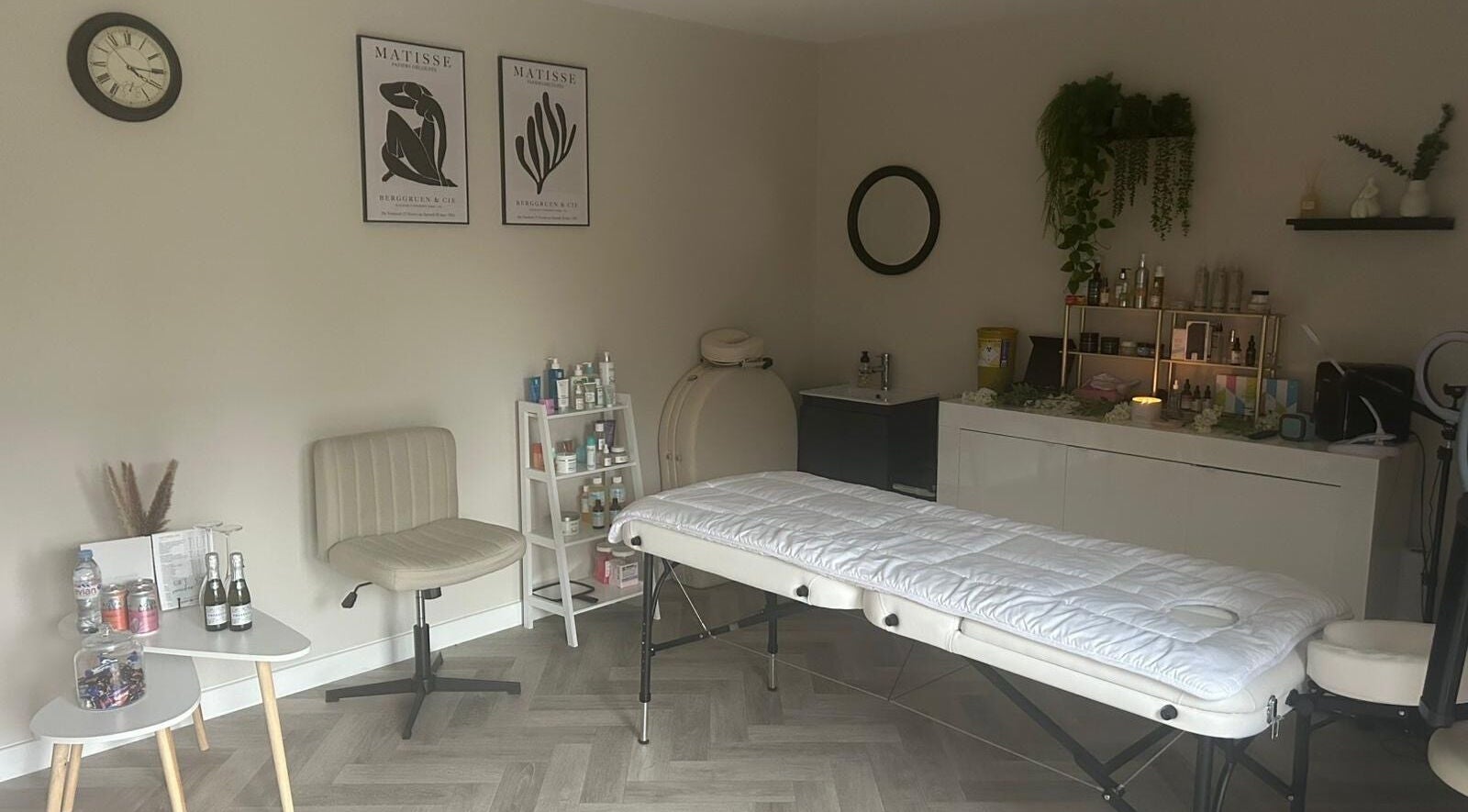 Peaceful therapy room at James Aesthetics in Northampton, England, GB, featuring a massage bed and calming decor.