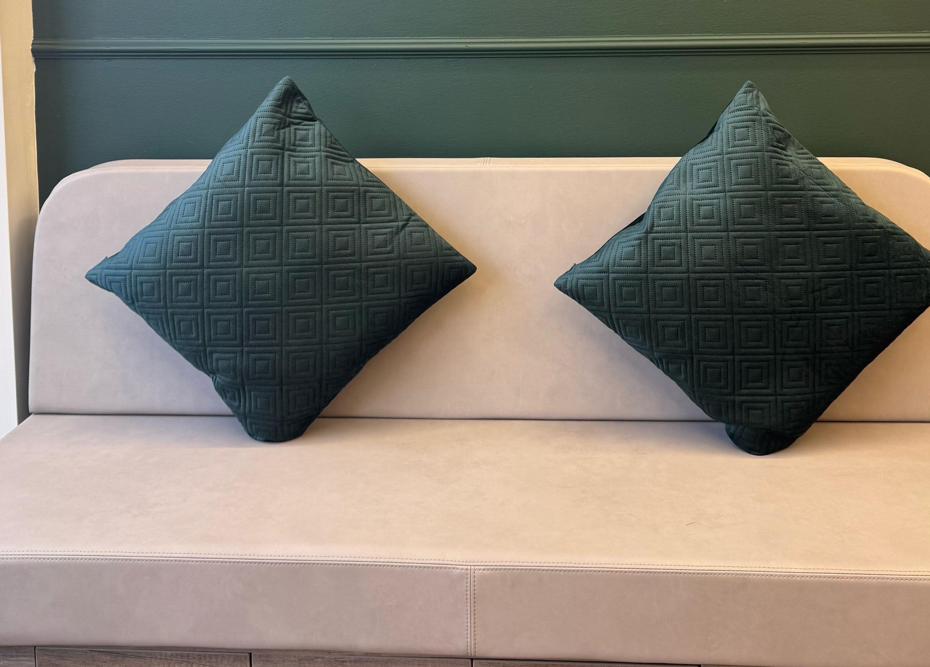 Cozy seating area with green cushions at Beauty Studio By K in St. Neots, England, GB.