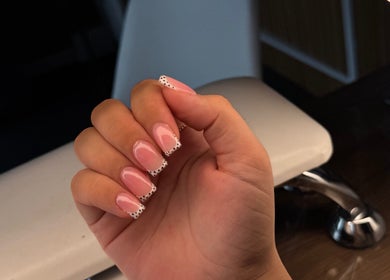 Polished pink nails with dotted tips at Serenity Beauty Studio, Ashton-in-makerfield, England, GB.