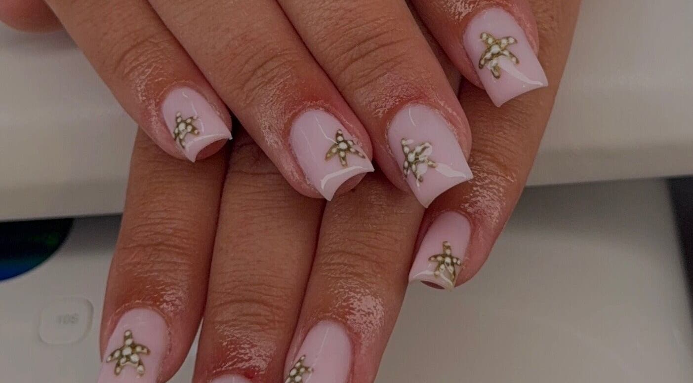 Elegant starfish nail art by Beauty by Meg in Newton-Le-Willows, England, GB. Perfect for a chic look.