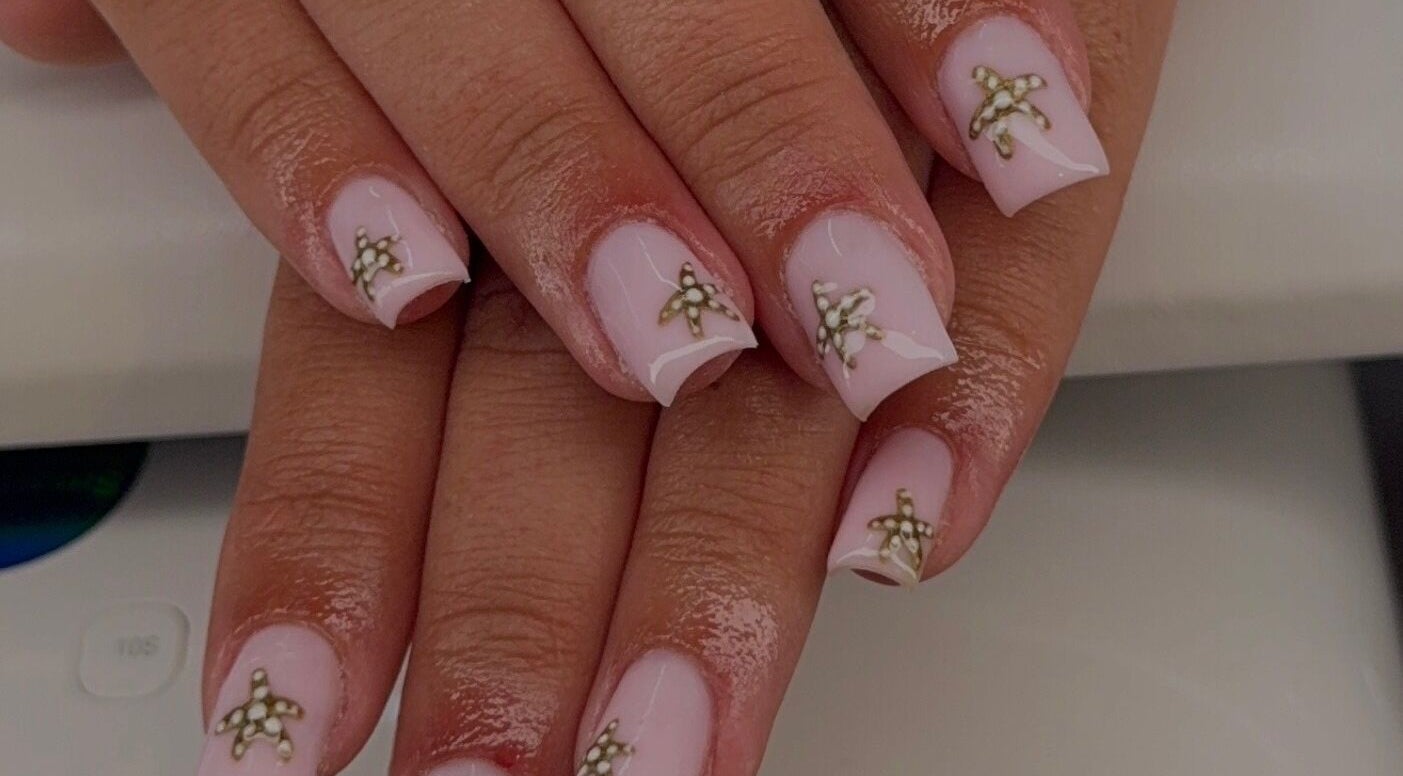 Elegant starfish nail art by Beauty by Meg in Newton-Le-Willows, England, GB. Perfect for a chic look.