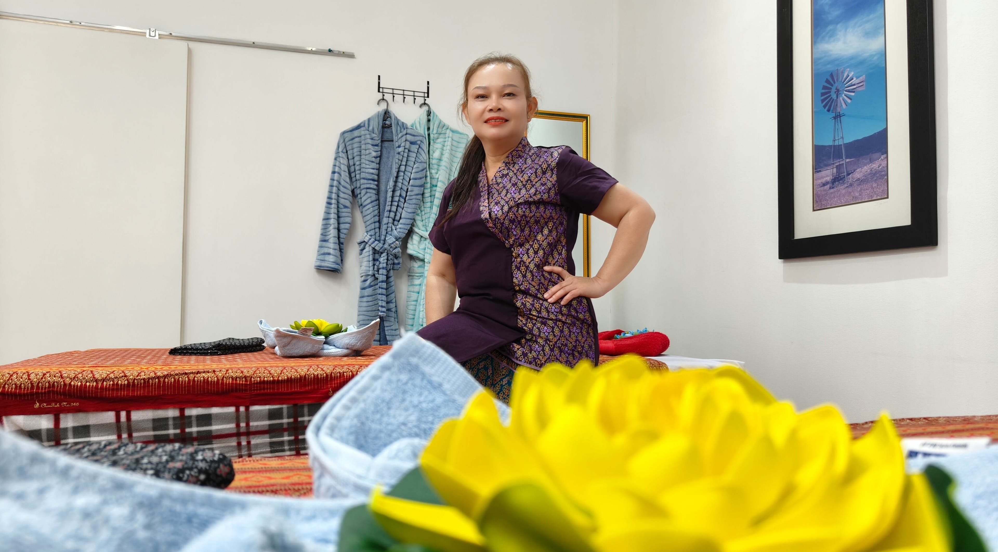 Inside Lek Ka Thai Massage Studio, Cape Town, showing therapist and soothing decor in Western Cape, ZA.