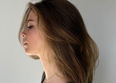 Side profile of woman showcasing elegant hairstyle at Simply, Gabriella in Newcastle, New South Wales, AU.