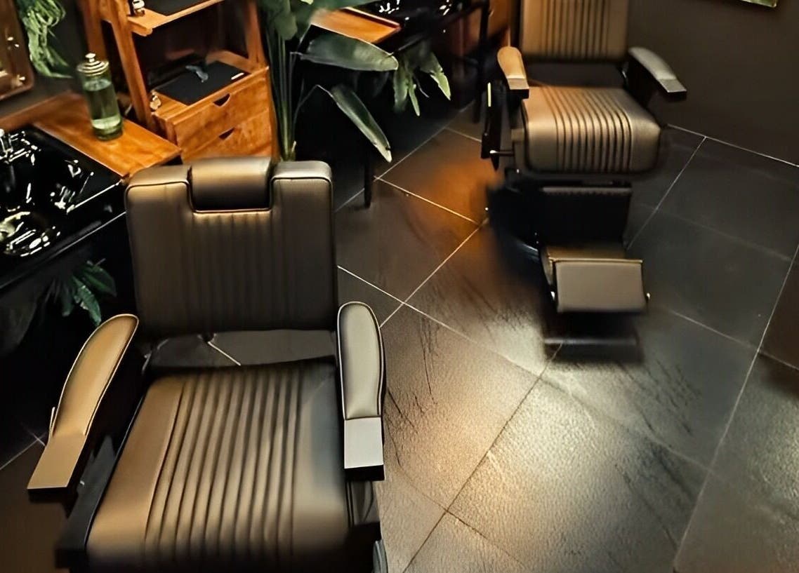 Luxurious barber chairs at Wild Barber Boat Avenue, Choeng Thale, Phuket, TH. Modern and stylish decor.