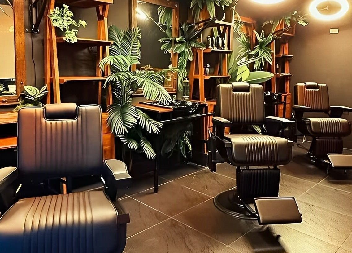 Stylish barber chairs and green decor at Wild Barber Boat Avenue, Choeng Thale, Phuket, TH.