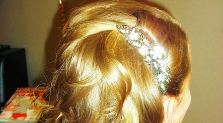 Stylish hair updo with floral clip at Myla @Battle Born Beauty Salon, Topaz Ranch Estates, Nevada, US.