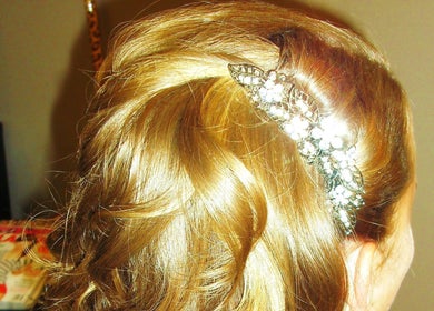 Stylish updo with jeweled hairpiece at Battle Born Beauty Salon, Topaz Ranch Estates, Nevada, US.