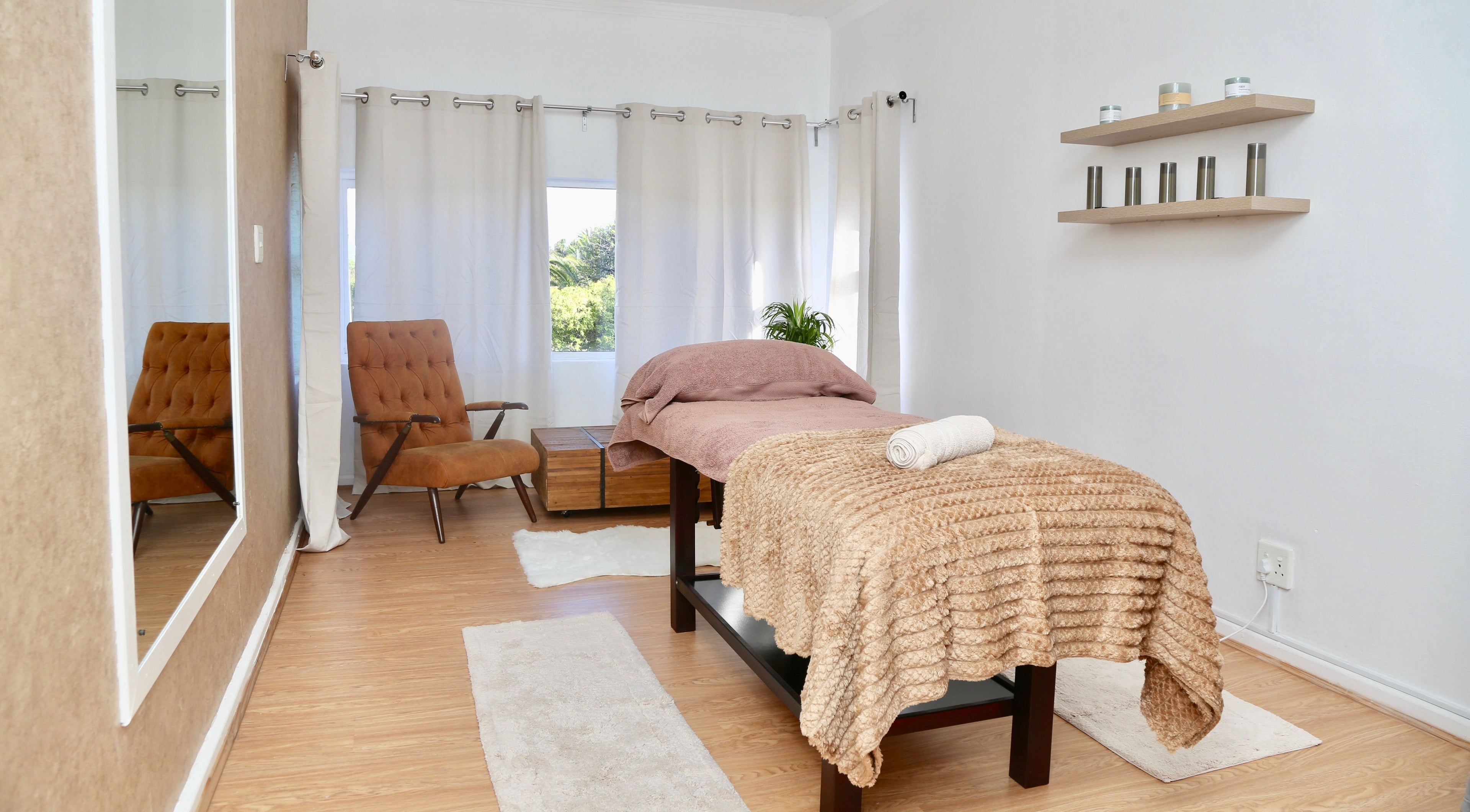 Calming massage room at Silk Beauty, Cape Town, Western Cape, ZA with serene decor and soft lighting.