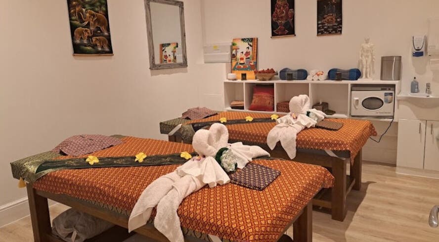 Elegant spa room at Supthara Thai Massage in Chigwell, England, GB, showcasing massage tables and serene decor.