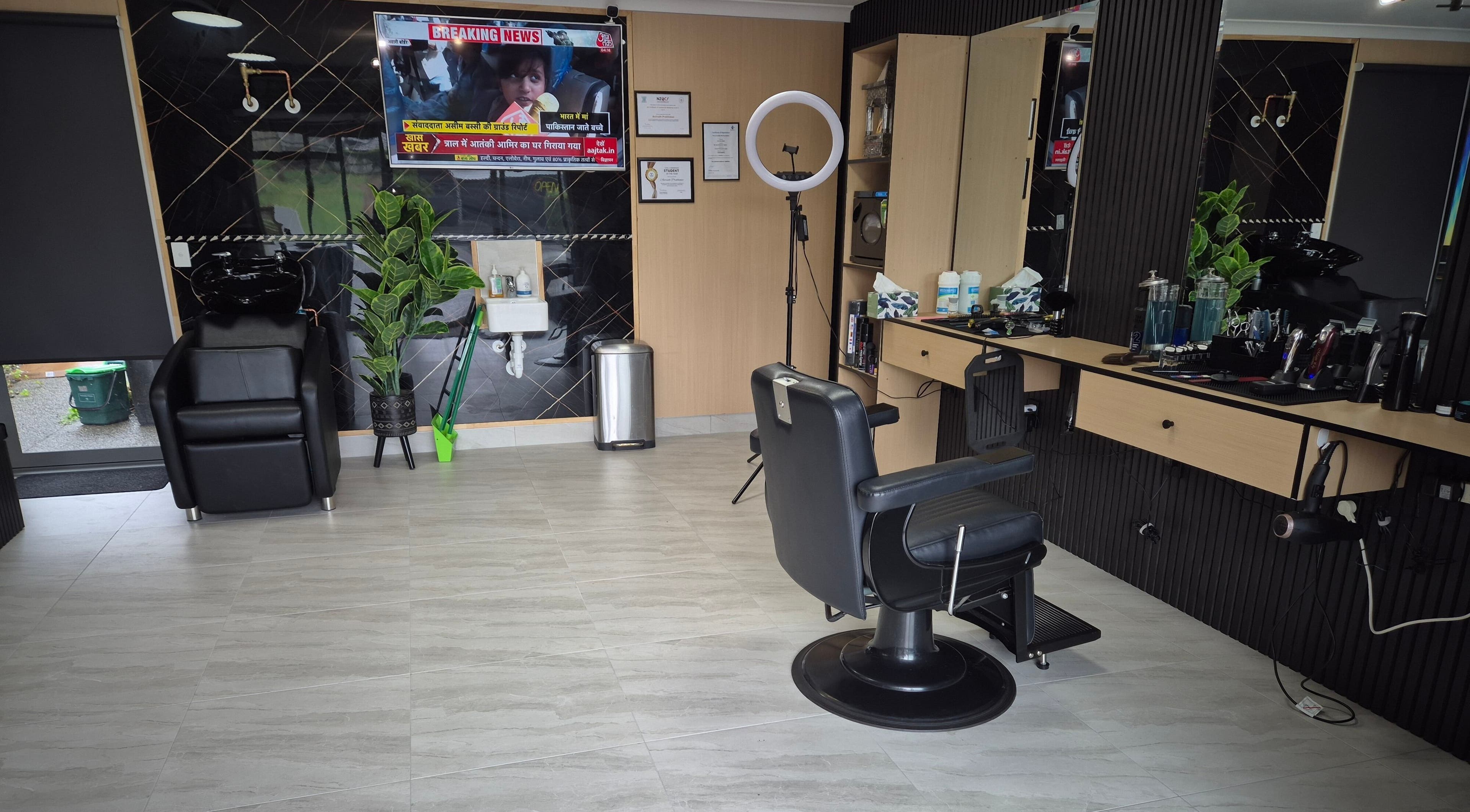 Modern interior of Barber Ani Tauranga in Tauranga, Bay of Plenty, NZ with stylish chairs and large mirrors.