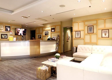 Bright lobby of Yinyang Spa-Village Mall in Dubai, Dubai, AE, featuring cozy seating and modern decor.