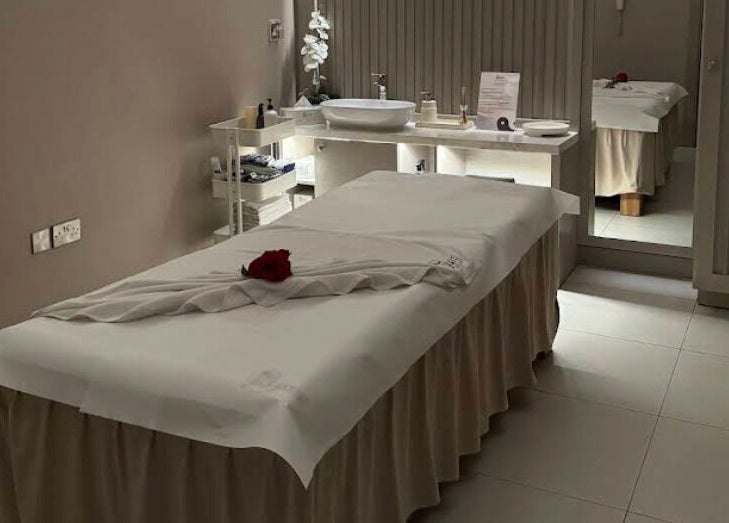 Relaxing massage room at Yinyang Spa - Al Ferdous in Dubai, Dubai, AE, featuring a plush treatment table.