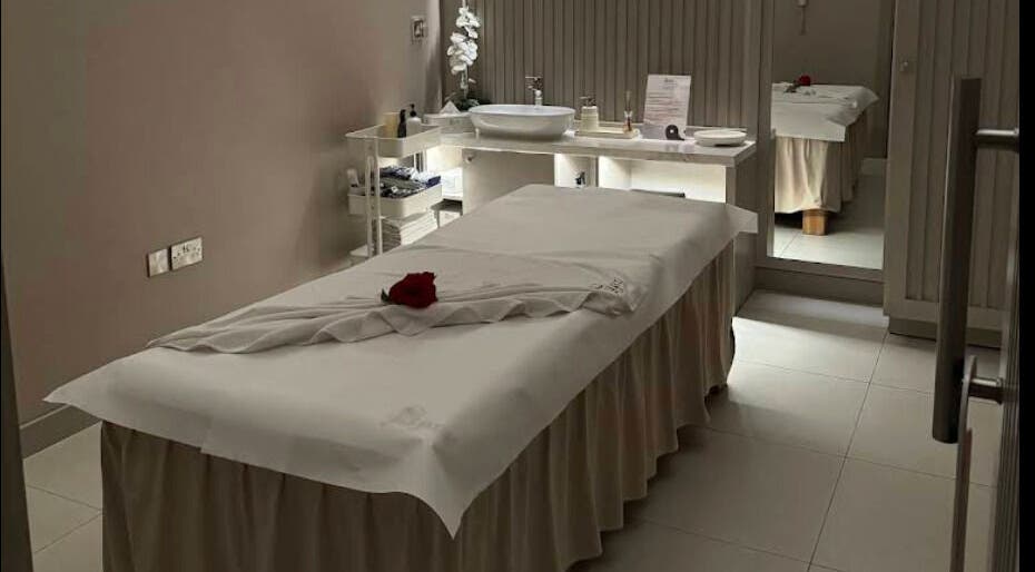Relaxing massage room at Yinyang Spa - Al Ferdous in Dubai, Dubai, AE, featuring a plush treatment table.