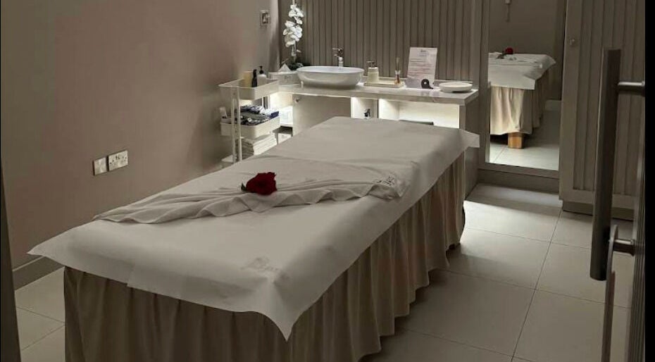 Relaxing massage room at Yinyang Spa - Al Ferdous in Dubai, Dubai, AE, featuring a plush treatment table.