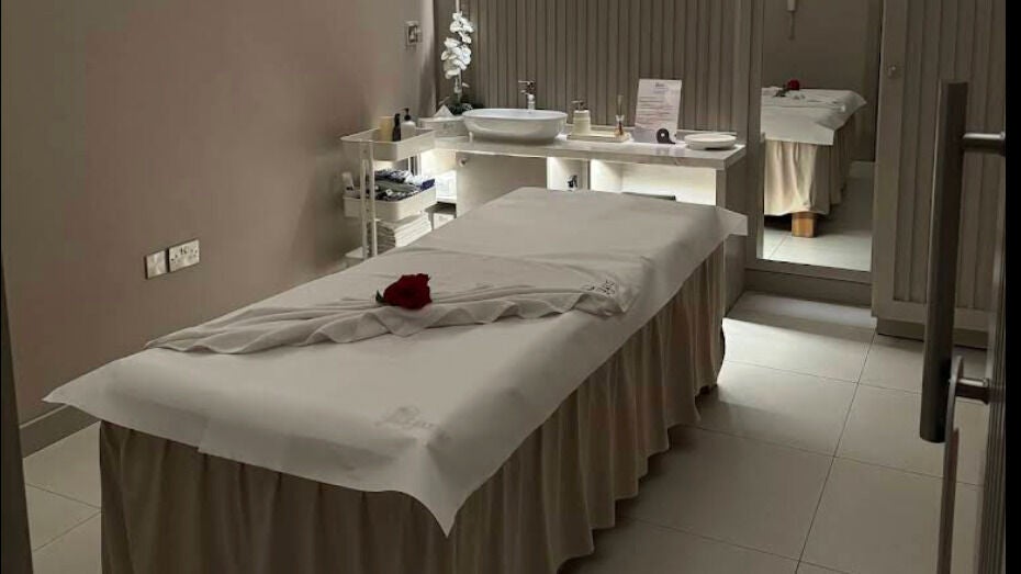 Relaxing massage room at Yinyang Spa - Al Ferdous in Dubai, Dubai, AE, featuring a plush treatment table.