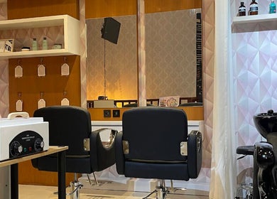 Modern interior of Le Naile Beauty Studio, Bali, Bali, ID showing chic salon chairs and styling area.