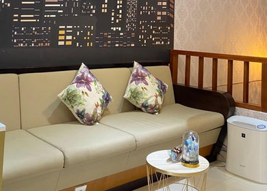 Cozy seating area with floral cushions at Le Naile Beauty Studio, Bali, Bali, ID.