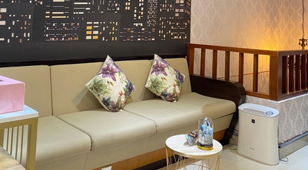 Inviting seating area at Le Naile Beauty Studio, Bali, Bali, ID with plush floral cushions.