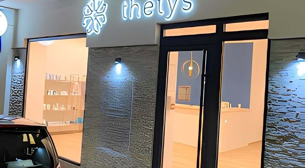 Centre Thetys Antibes entrance in Antibes, Provence-alpes-côte D'azur, FR, warmly lit modern spa facade.