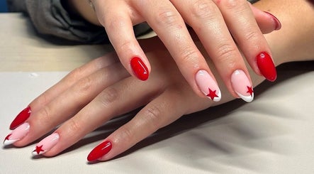 Elegant star-themed red nails at Bydarcyella, Birmingham, England, GB.