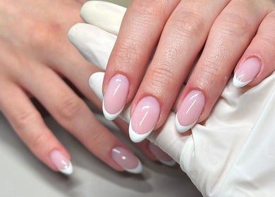 Elegant French manicure at Bydarcyella, Birmingham, England, GB, showcasing detailed nail art.