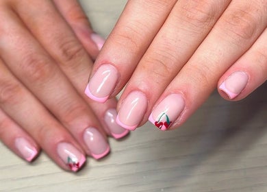 Elegant pink French manicure with floral art at Bydarcyella, Birmingham, England, GB.