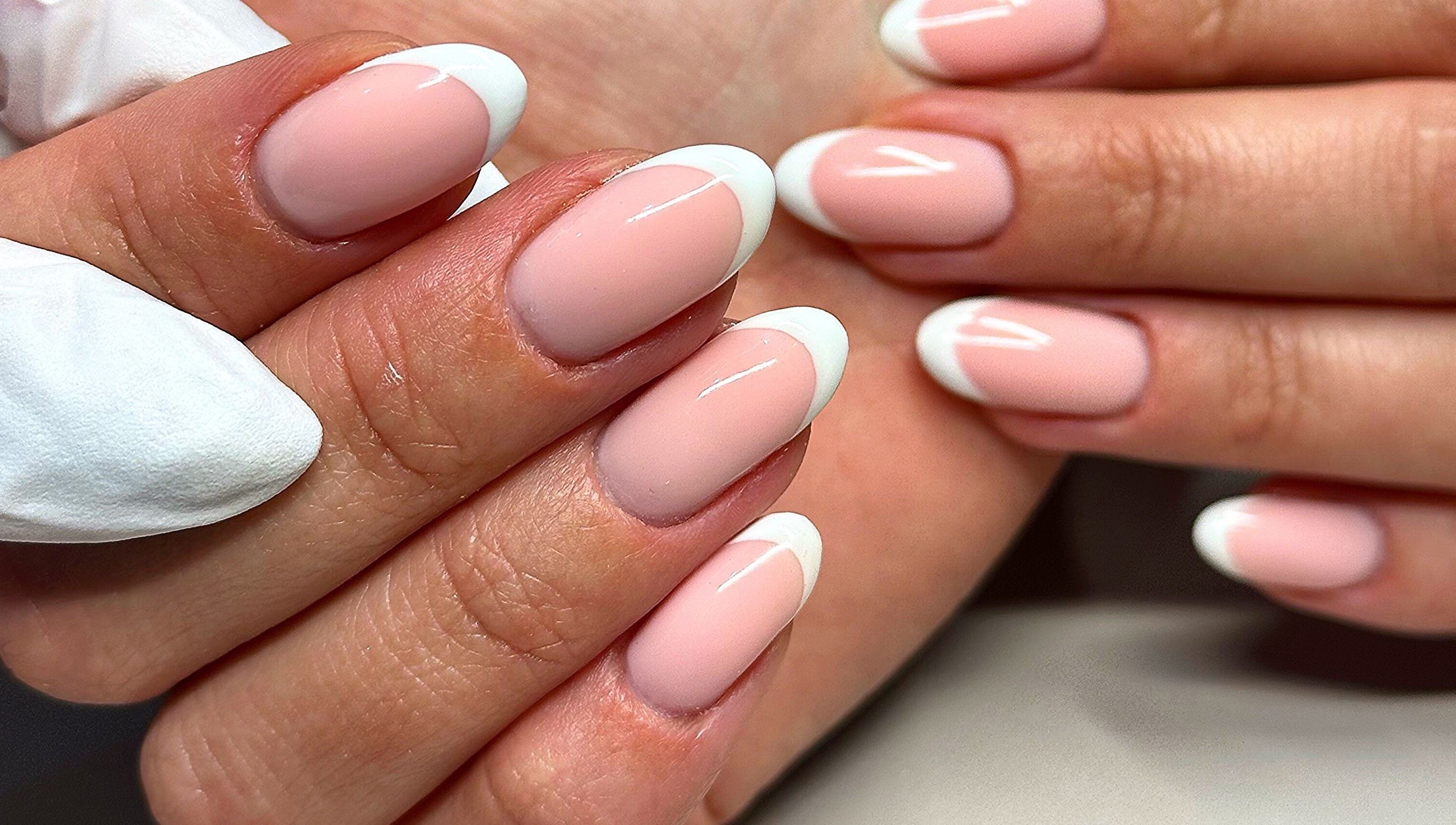 Elegant French manicure at Bydarcyella, Birmingham, England, GB showcasing pristine nail art.