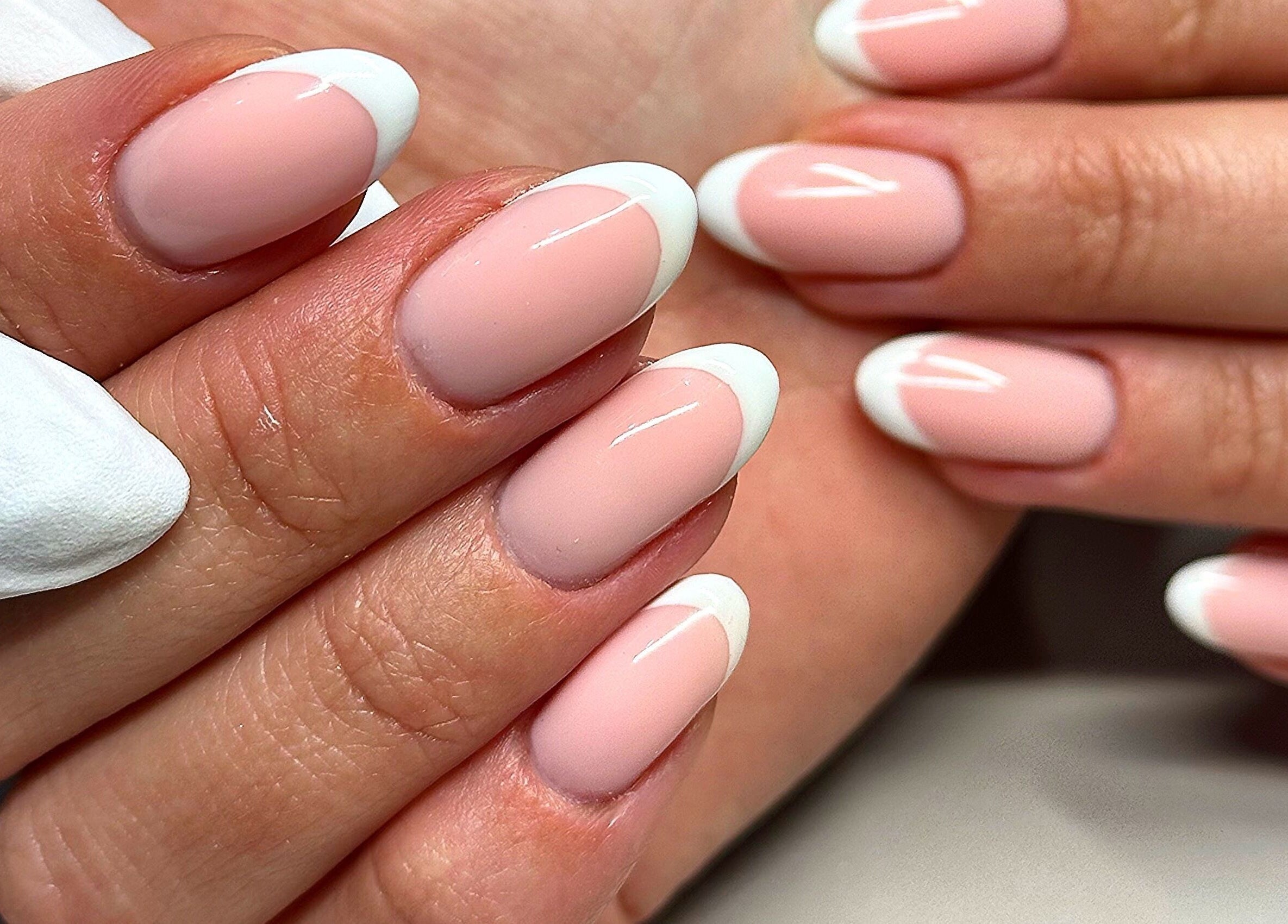 Elegant French manicure at Bydarcyella, Birmingham, England, GB showcasing pristine nail art.