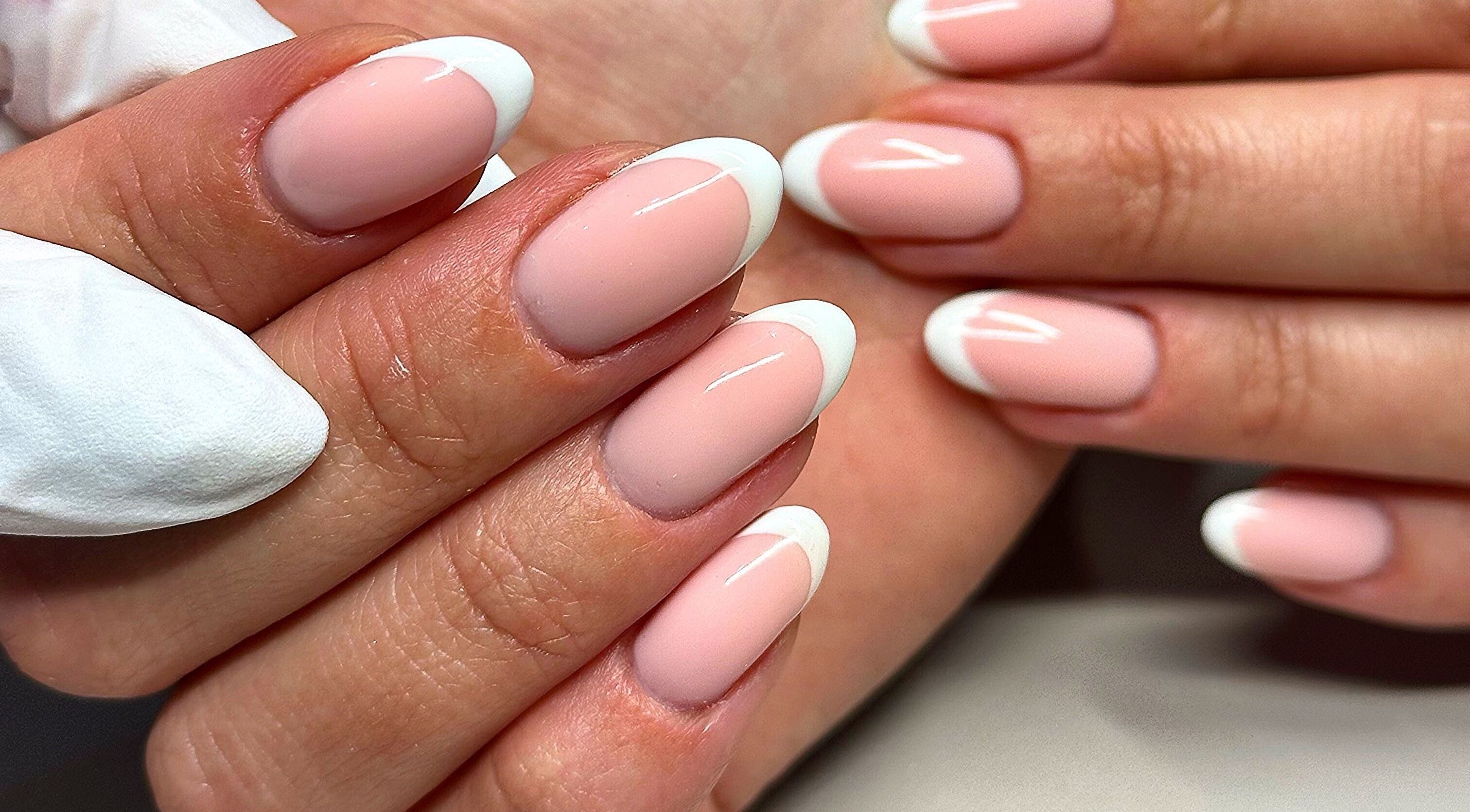 Elegant French manicure at Bydarcyella, Birmingham, England, GB showcasing pristine nail art.