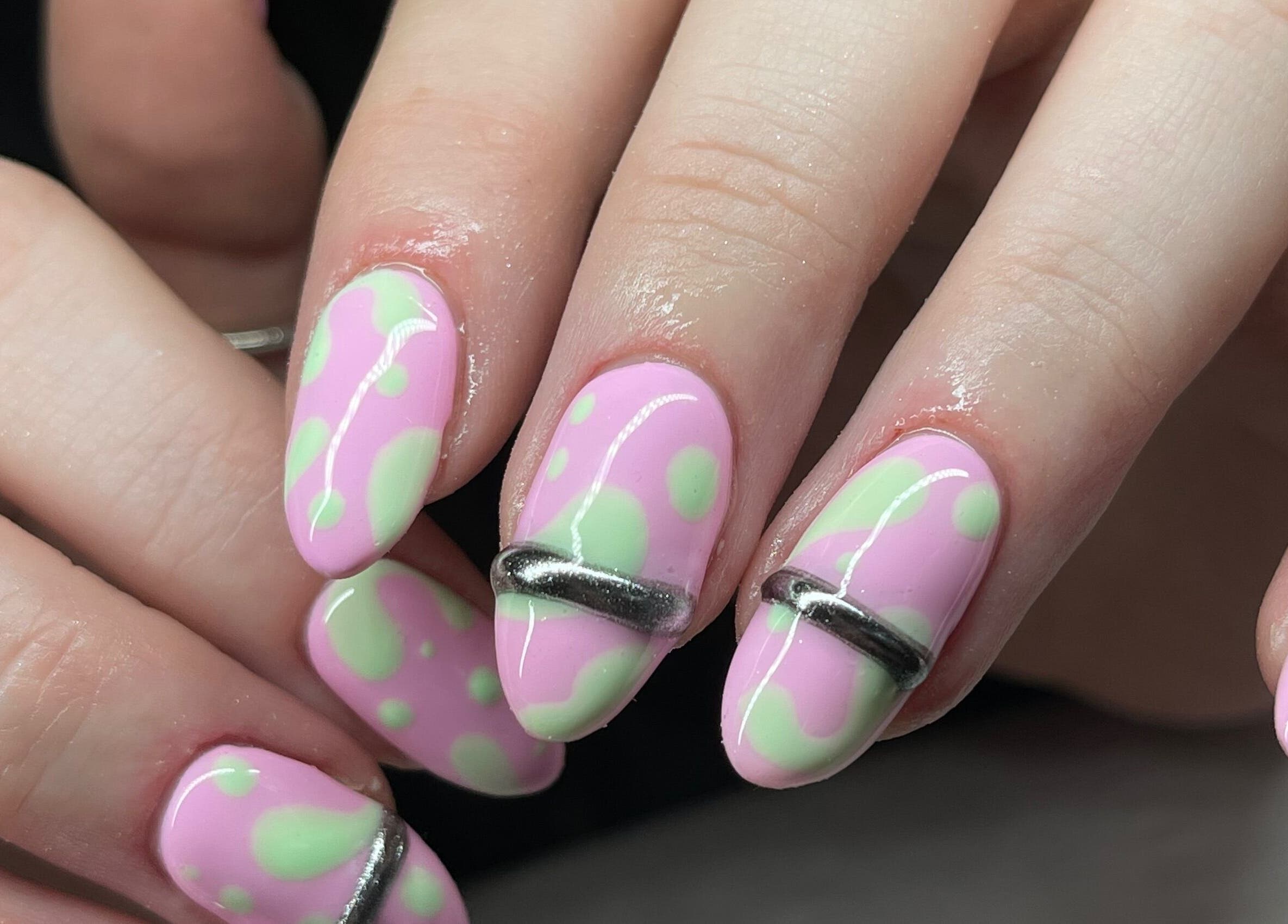 Close-up of trendy pink and green nail art at Fashi0n.Victim, Manchester, England, GB.