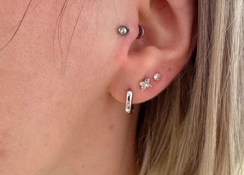 Stylish ear piercings at Selina Janes, Ayr, Scotland, GB featuring multiple elegant earrings.