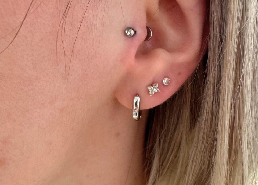 Stylish ear piercings at Selina Janes, Ayr, Scotland, GB featuring multiple elegant earrings.