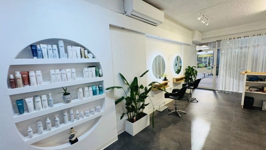 Zen by the Bay salon interior with sleek shelves and mirrors at Shoal Bay, New South Wales, AU.