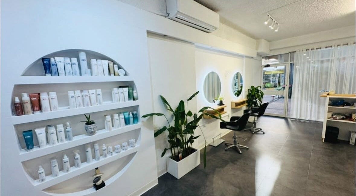 Zen by the Bay salon interior with sleek shelves and mirrors at Shoal Bay, New South Wales, AU.