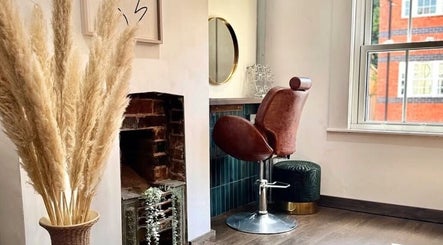 Elegant salon chair and mirror setup at Salon Pickle, Bromsgrove, England, GB.