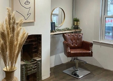 Salon Pickle's chic styling chair with art and mirror in Bromsgrove, England, GB.