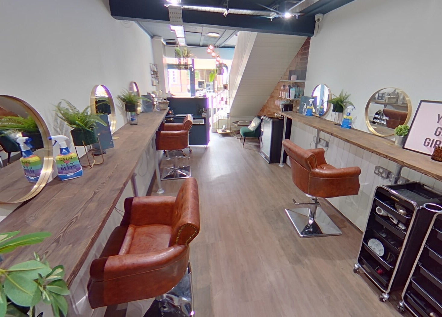 Salon Pickle in Bromsgrove, England features stylish brown chairs and modern decor.