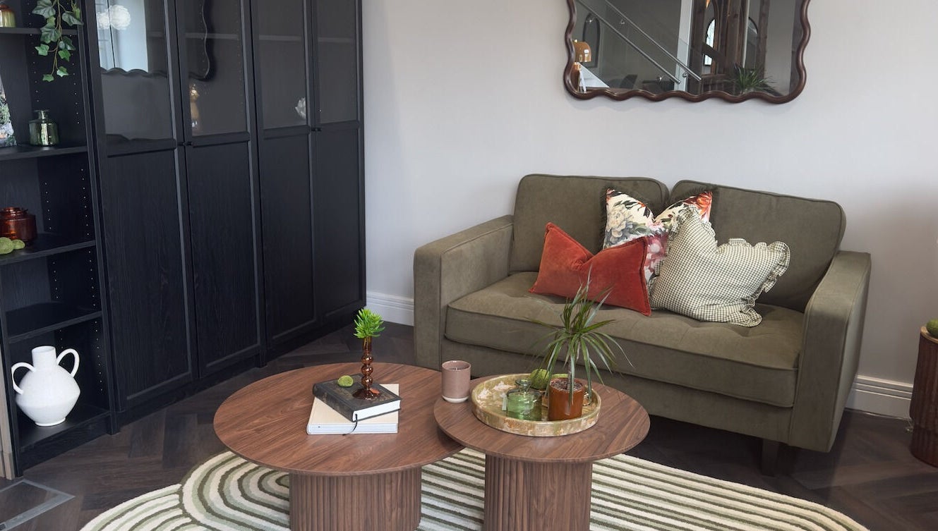 Elegant lounge area at Jordan's, Shenley, England, GB, featuring a chic sofa and modern decor.