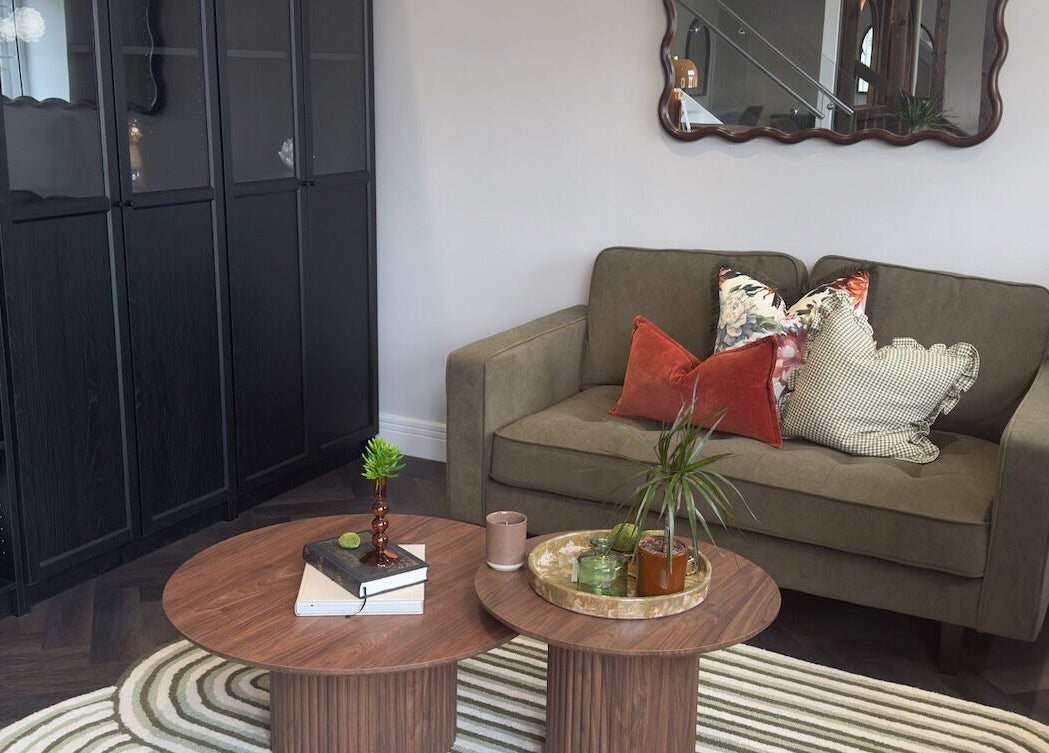 Elegant lounge area at Jordan's, Shenley, England, GB, featuring a chic sofa and modern decor.