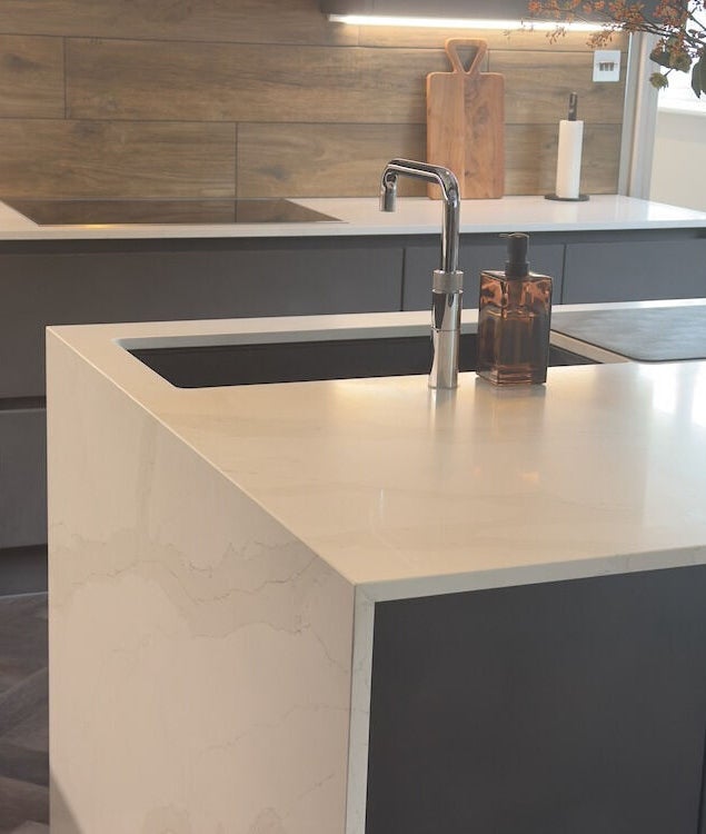 Elegant kitchen space at Jordan's in Shenley, England, GB, featuring sleek countertops and tasteful decor.